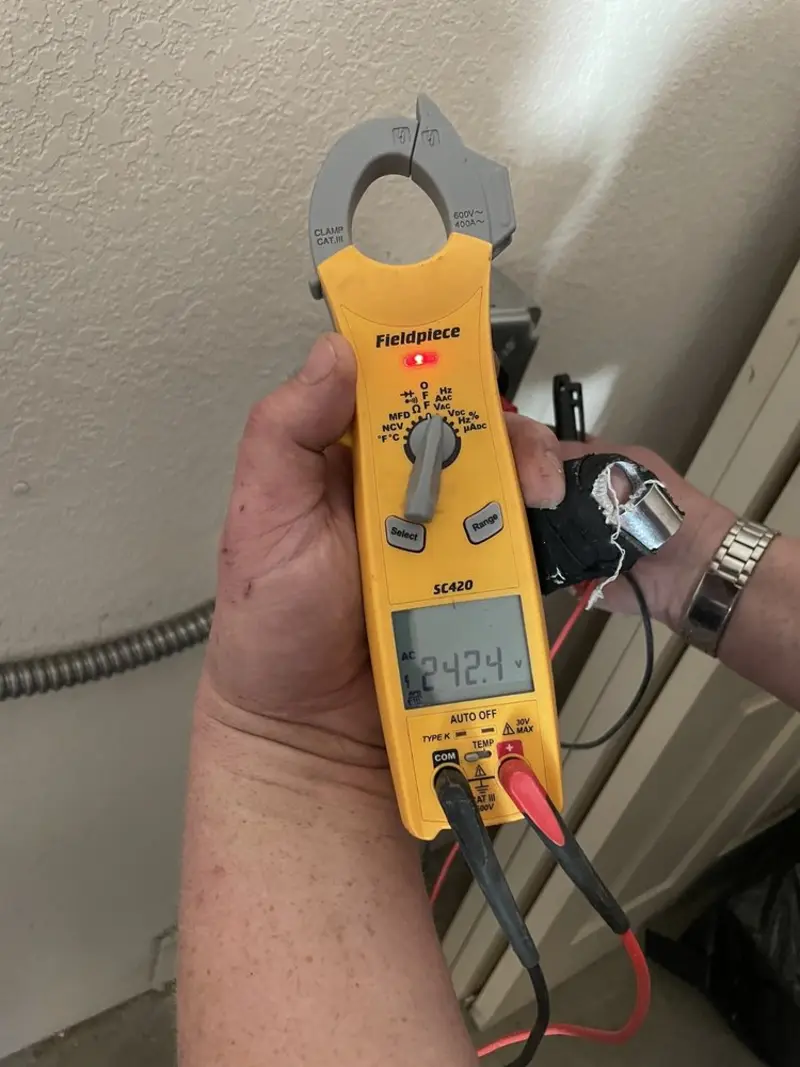 Voltage testing with clamp meter during Generator Installation in Inver Grove Heights